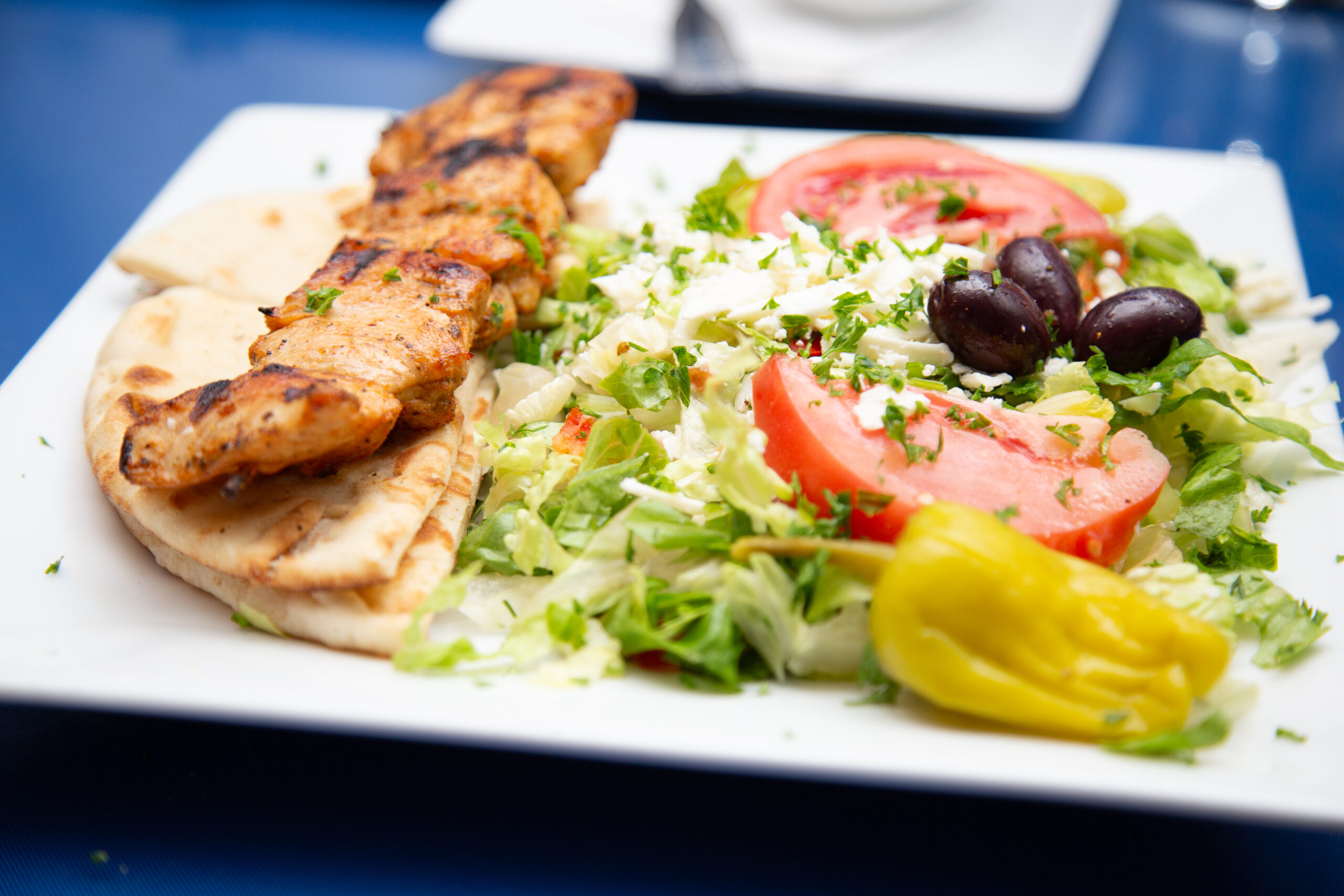 Greek kabob plate with rice pilaf and salad from Zorba The Greek Express, perfect for catering in Coram, NY